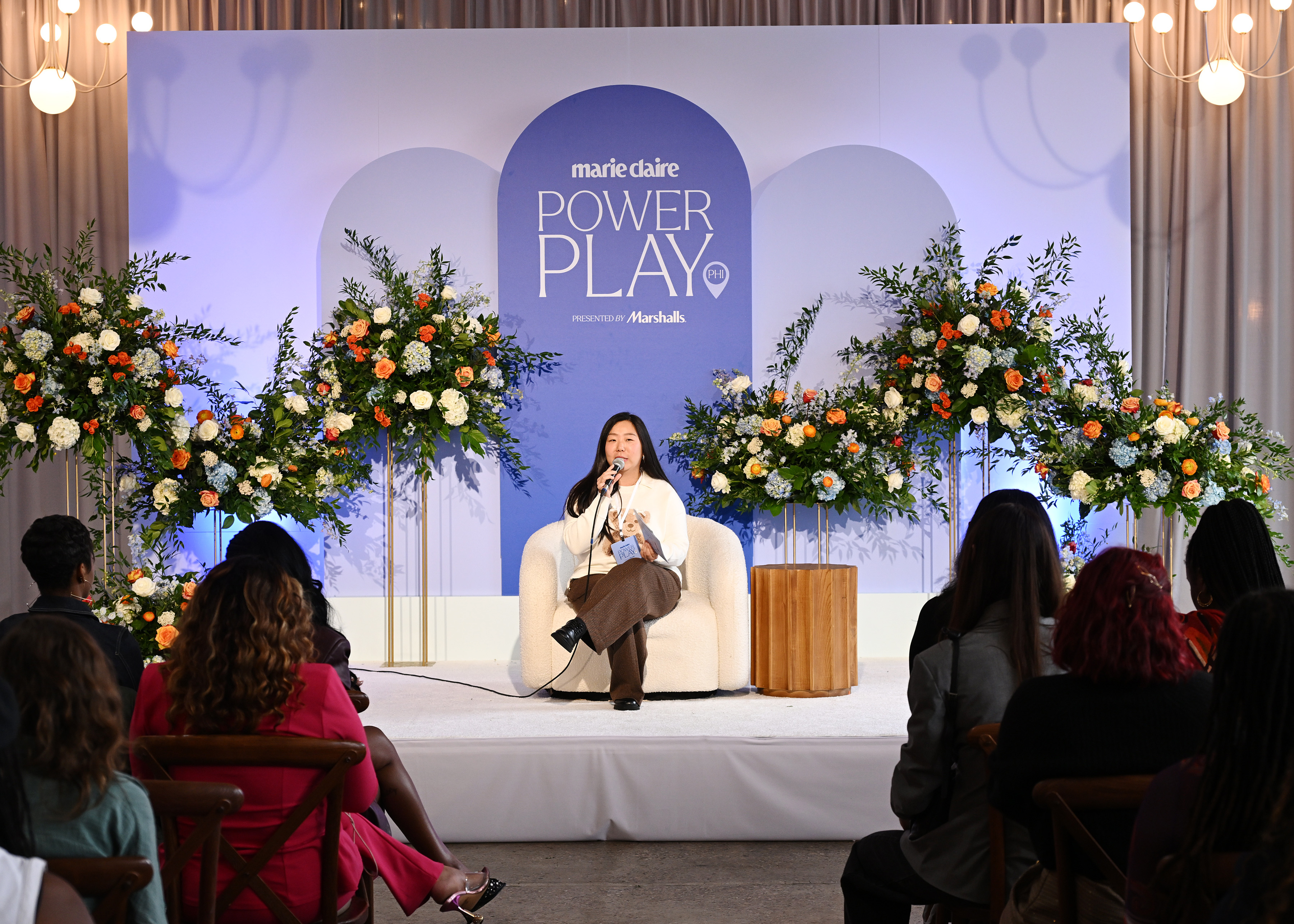 Jung Park onstage speaking into a microphone at Power Play.