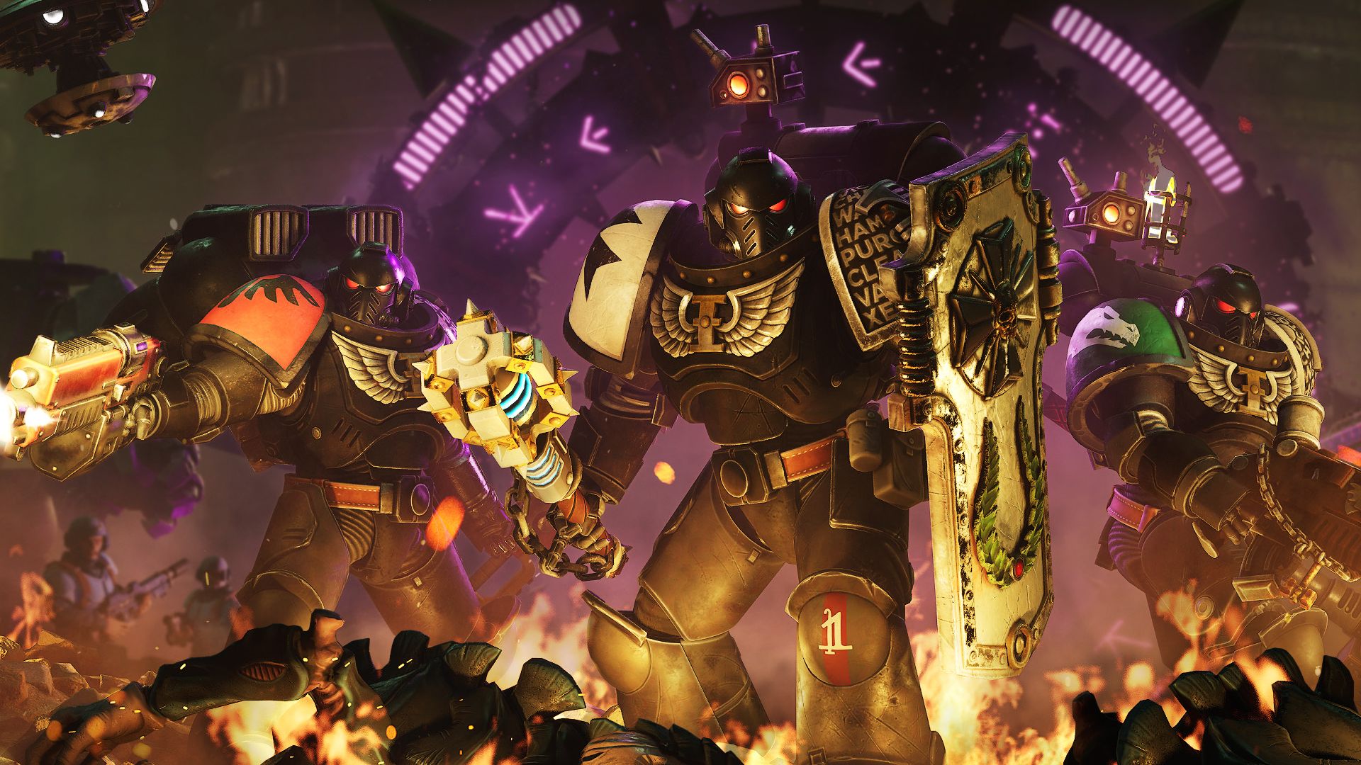 Three Deathwatch marines stand in burning alien corpses