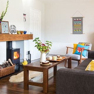 Living room with white wall and stove