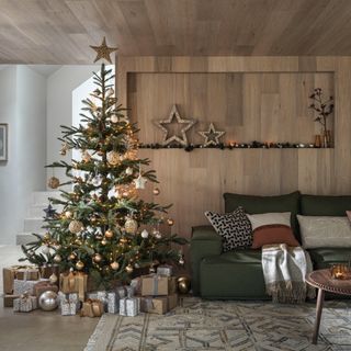 a natural tree in a Scandi-style living room full of Christmas decor