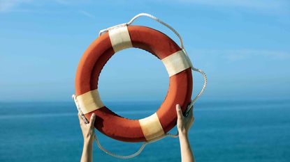 person holding up life preserver
