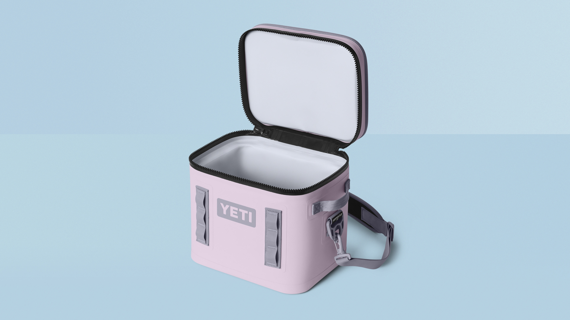 YETI soft cooler on blue background