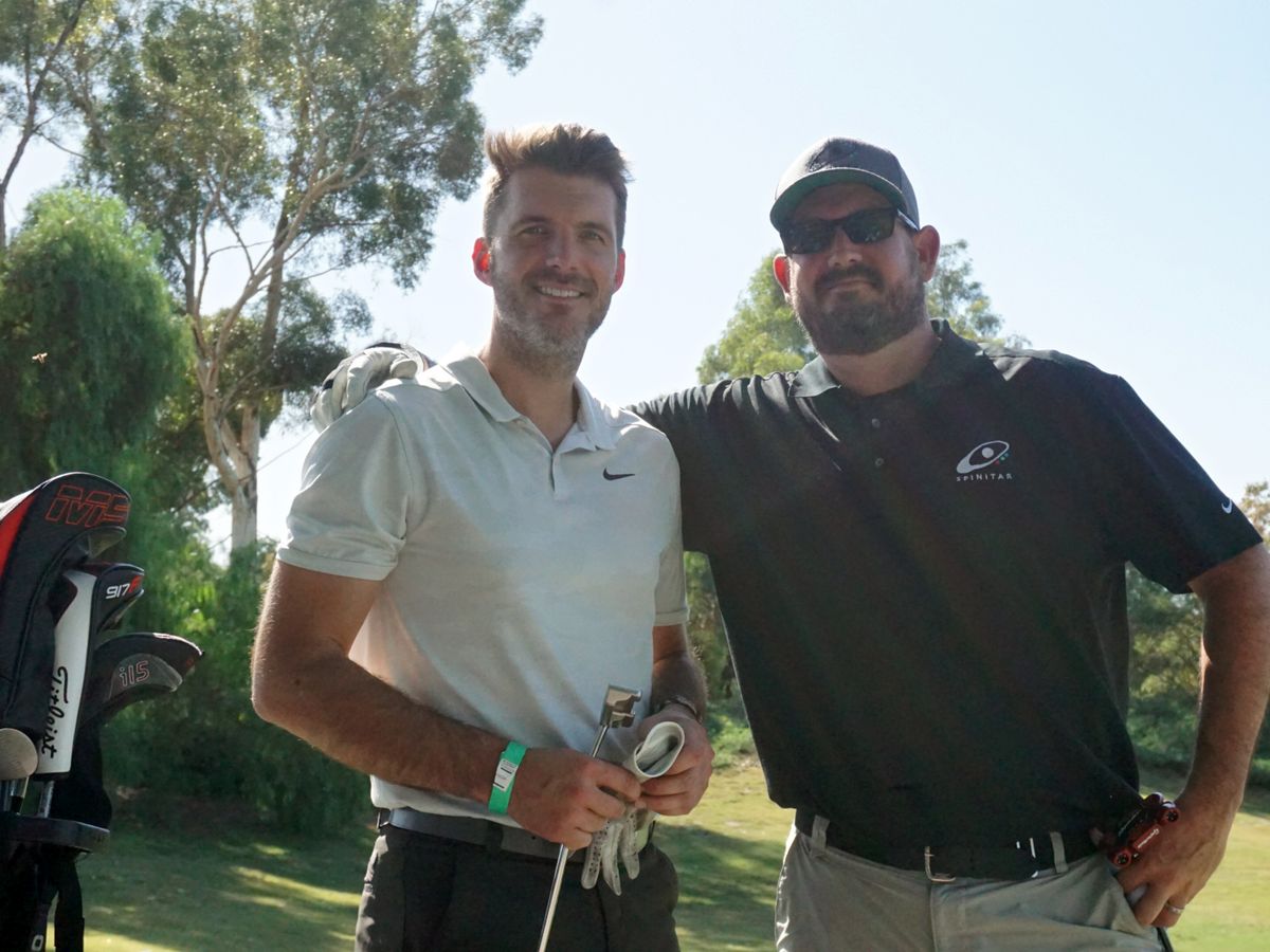 Spinitarian and guest at fifth annual Golf for Hope charity event.