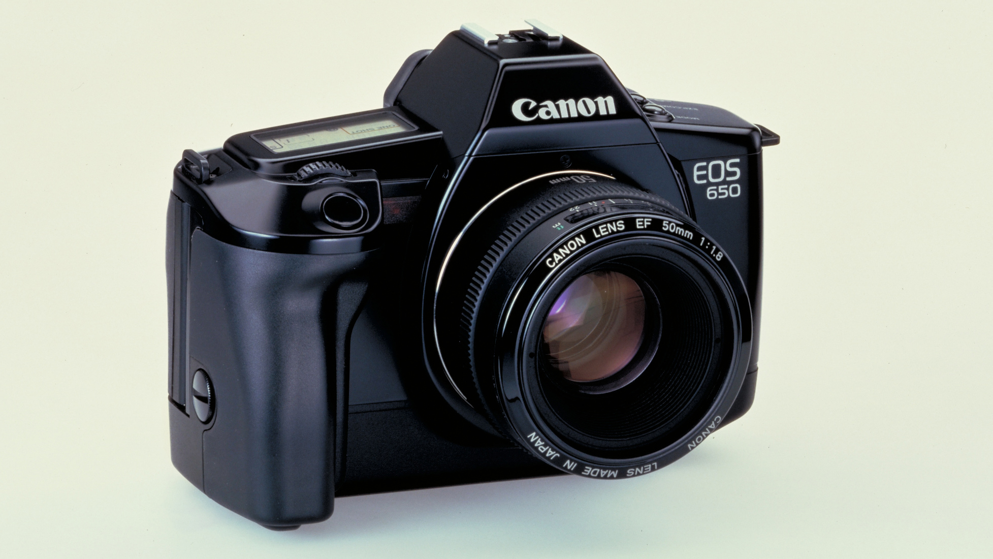 The Canon EOS 650 camera on a beige background