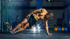 Man performing a side plank for his obliques