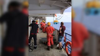 Romuald Daniel and the crew of the research vessel Marion Dufresne deploy an ocean-bottom seismometer to record the seismicity offshore near the new volcano.