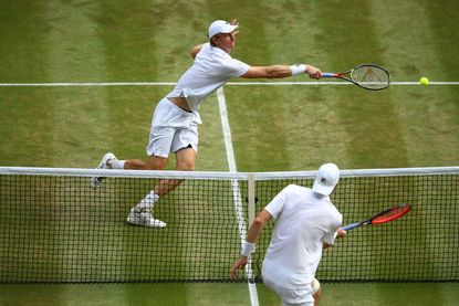 Kevin Anderson battles John Isner at Wimbledon 2018.
