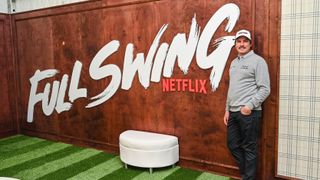 Joel Dahmen smiles in front of a Full Swing sign in the Netflix Full Swing Clubhouse during practice for the Genesis Invitational at Riviera Country Club on February 15, 2023 in Pacific Palisades, California.