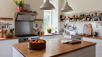 A kitchen island with a wooden top in a kitchen