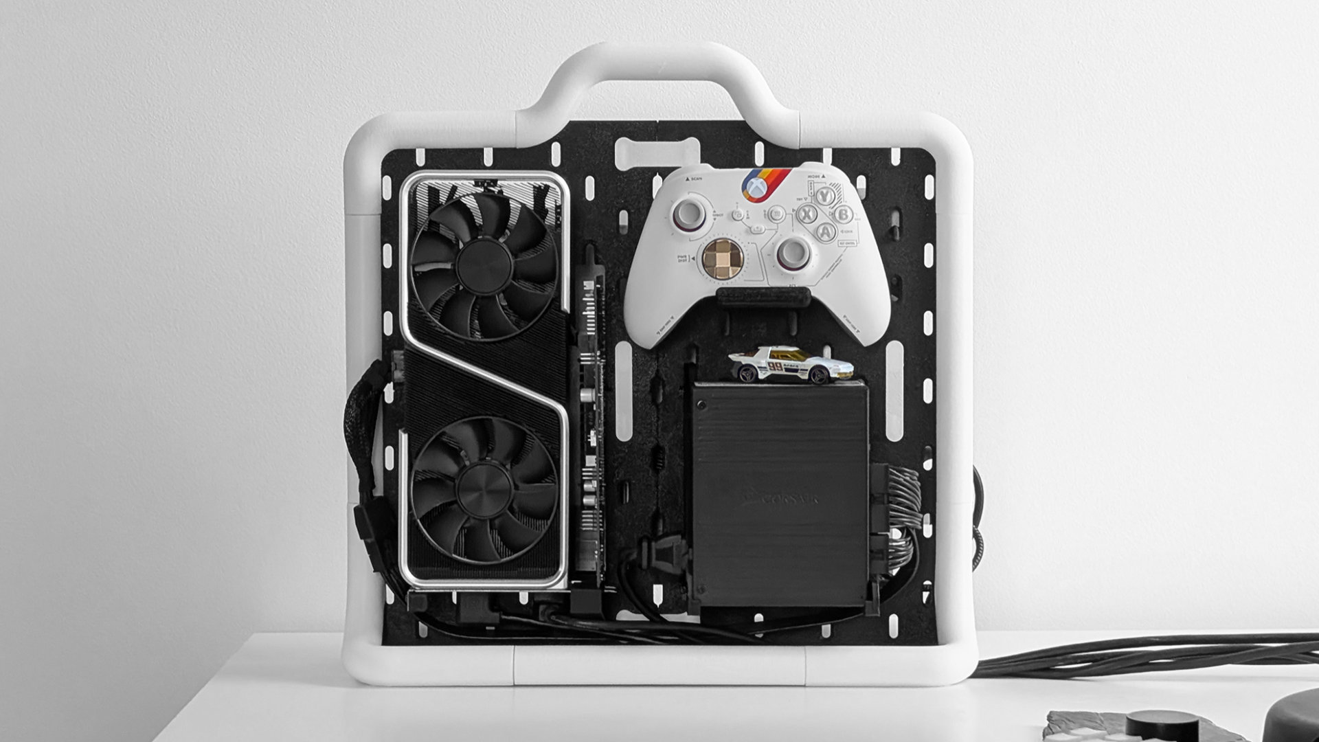 A photo of a 3D printed 'Laptop eGPU "Suitcase" SKADIS Frame', created by MakerWorld user MPKVR