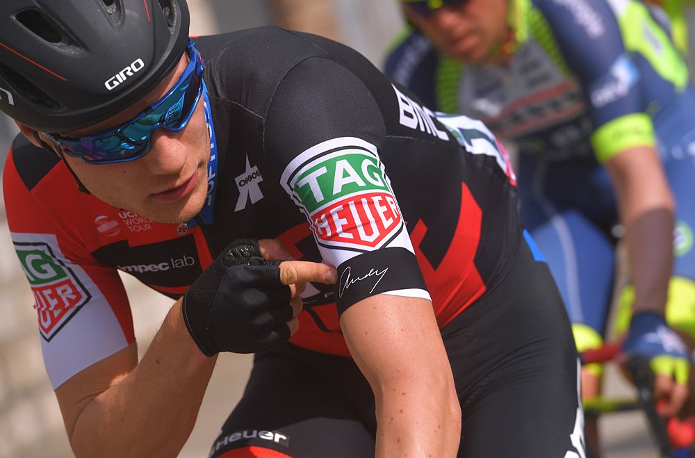 Loic Vliegen (BMC Racing Team) points to his jersey in memory of team owner the late Andy Rihs