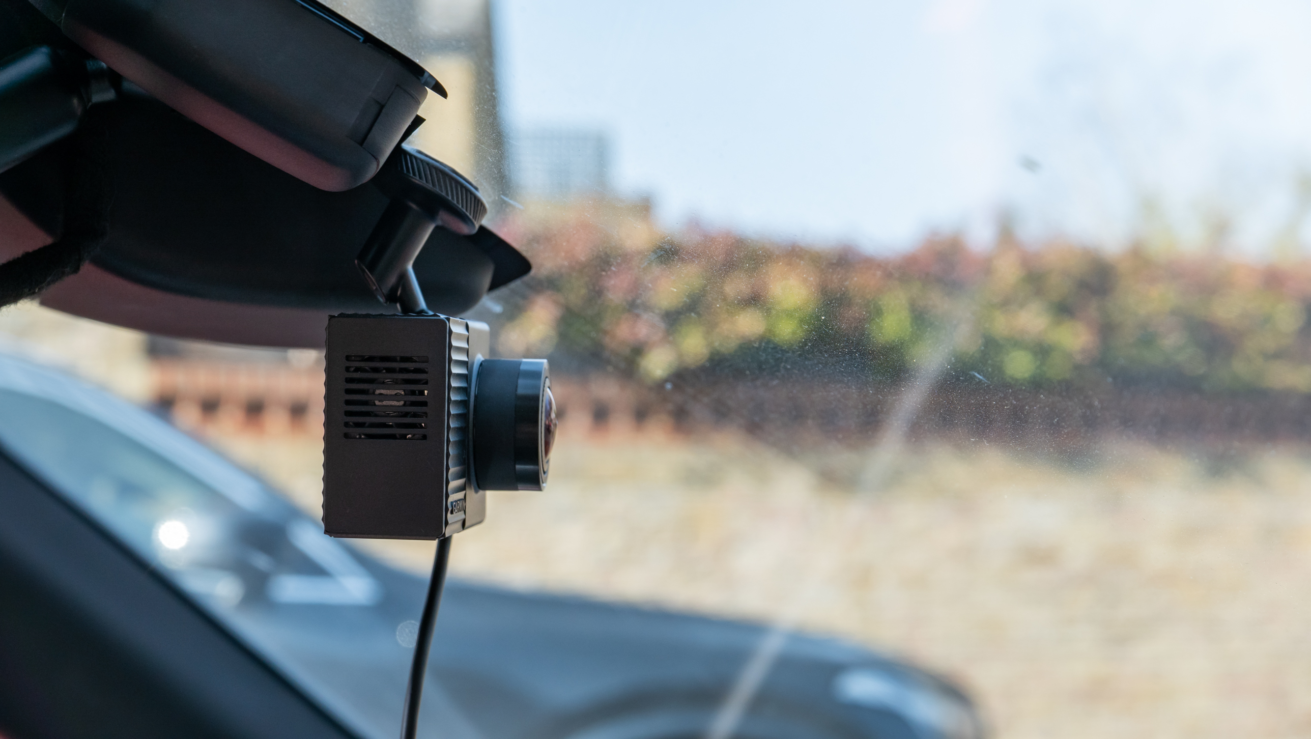 The Garmin Dash Cam Tandem mounted in a windshield