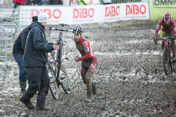 Shoulder hand-up: Geoff Proctor hoisting a bike up to Justin Lindine; Baal bPost, January 2013.
