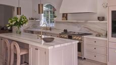 Neutral marble kitchen with island