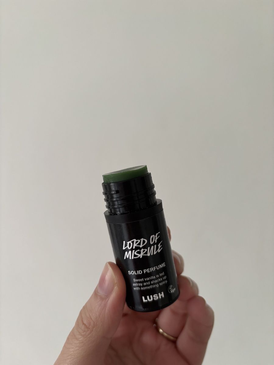 Mica Ricketts holding Lush Lord of Misrule Solid Perfume