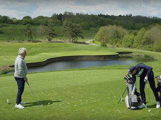 golfer rummaging in bag