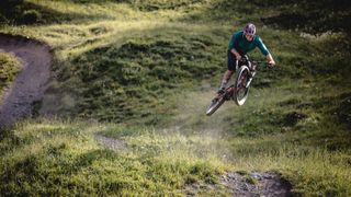 A mountain bike does a jump