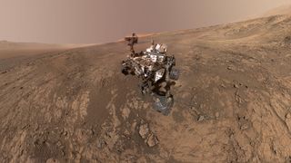 The Curiosity rover on Vera Rubin Ridge, where it will potentially search for fatty acids left by ancient Martian microbes.