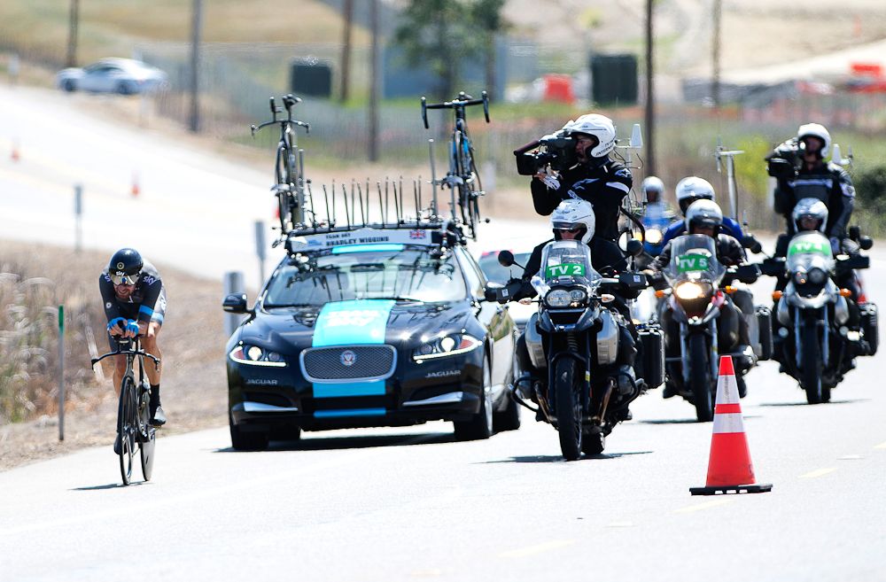 TV motos follow Bradley Wiggins on his way to victory in the 2014 Folsom Time Trial.