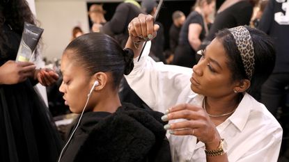 new york, new york february 12 hair stylist ursula stephen and a model prepare backstage at tresemme x serena williams during nyfw on february 12, 2020 in new york city photo by monica schippergetty images for tresemme