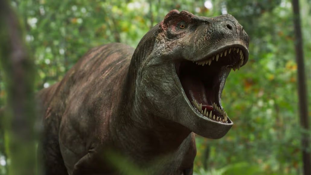 A still from the BBC documentary series Walking With Dinosaurs showing a T-Rex roaring