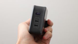 Ugreen Nexode 140W charger held in a hand