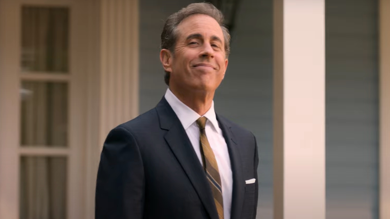 Jerry Seinfeld smirks in front of his house in Unfrosted: The Pop-Tart Story.