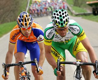 Alexandre Moos (R-Phonak) and Oscar Freire (L-Rabobank) ride in front the pack during the 202km Fleche Wallonne in 2006.