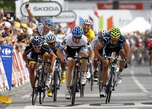 Tylar Farrar (Garmin-Cervelo) outkicked Romain Feillu, left, and Spanish champion Jose Joaquin Rojas, right, to claim his first-ever Tour stage victory.