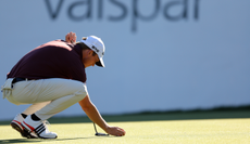 Jacob Bridgeman lines up a putt