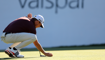 Jacob Bridgeman lines up a putt