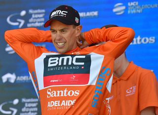 Richie Porte puts on the ochre jersey after winning stage 2 at the Tour Down Under