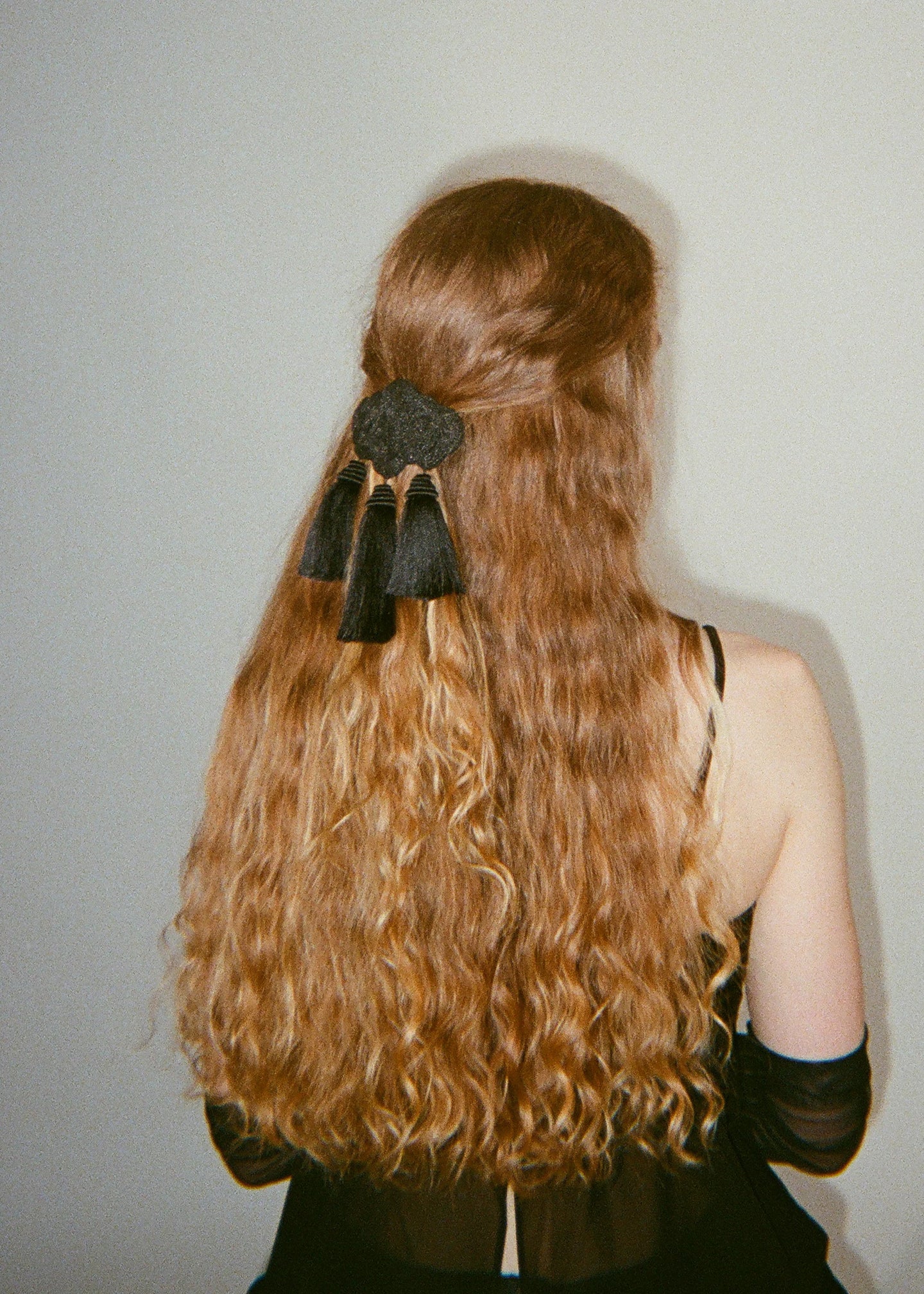 A balck hair pin with tassels