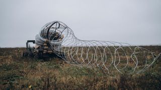 A Ukrainian unmanned ground vehicle laying barrier in the frontline
