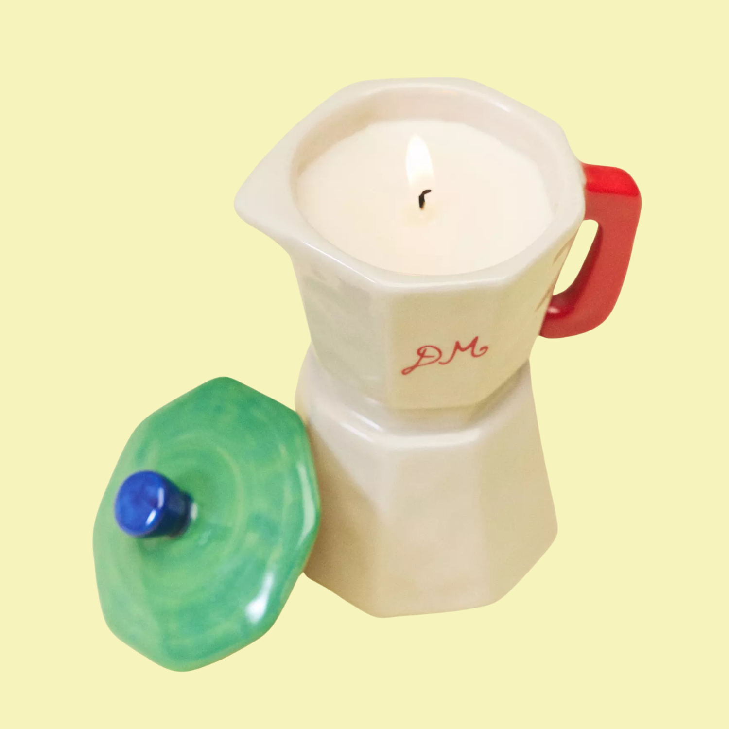 A ceramic moka pot shaped ceramic candle
