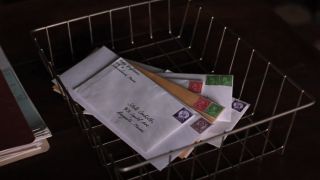 Outgoing mail shown on a desk in The Shawshank Redemption.