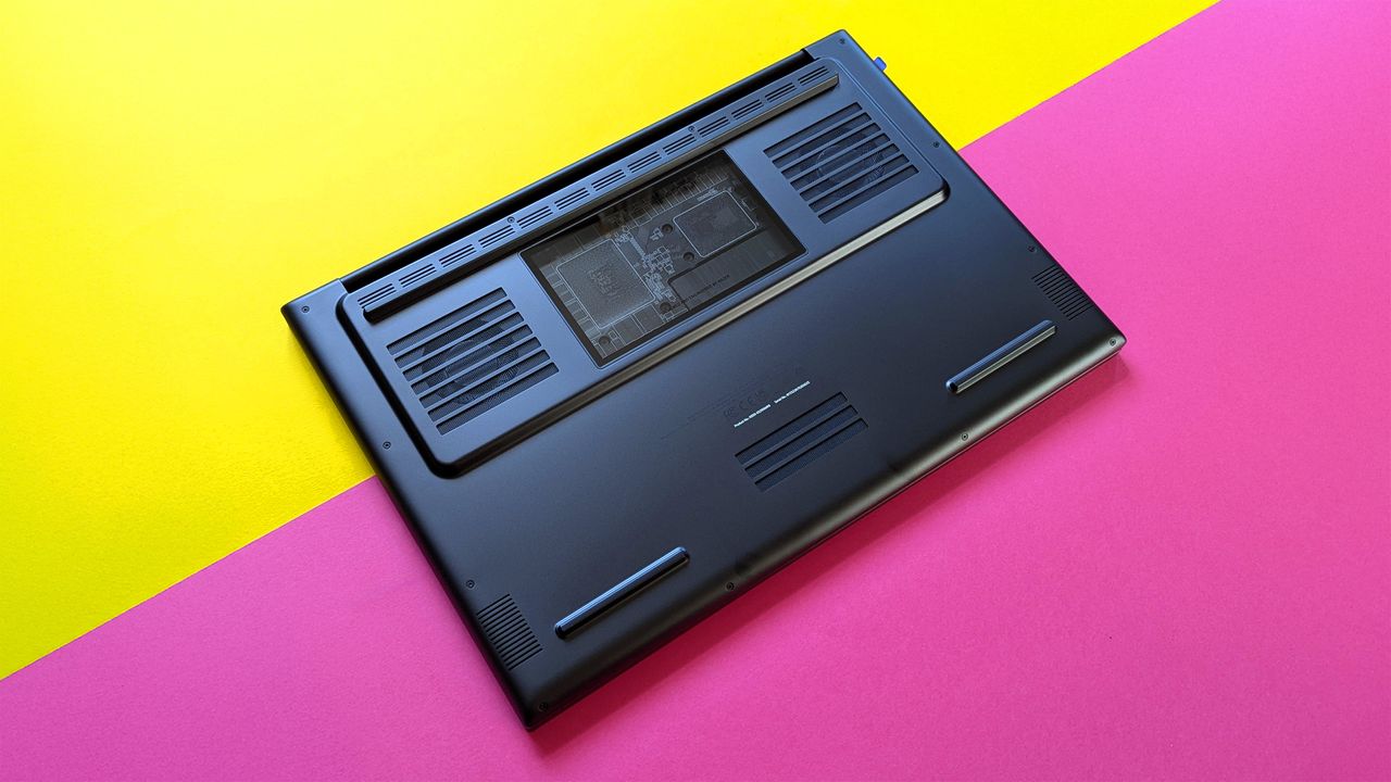 Razer Blade 18 (2025) gaming laptop on a pink and yellow background.