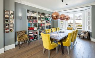 copper pendants over dining room table in renovated period home