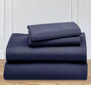a stack of navy cotton bedding