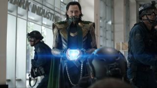Tom Hiddleston holds the Tesseract in the lobby of Stark Tower in Loki Season 1.