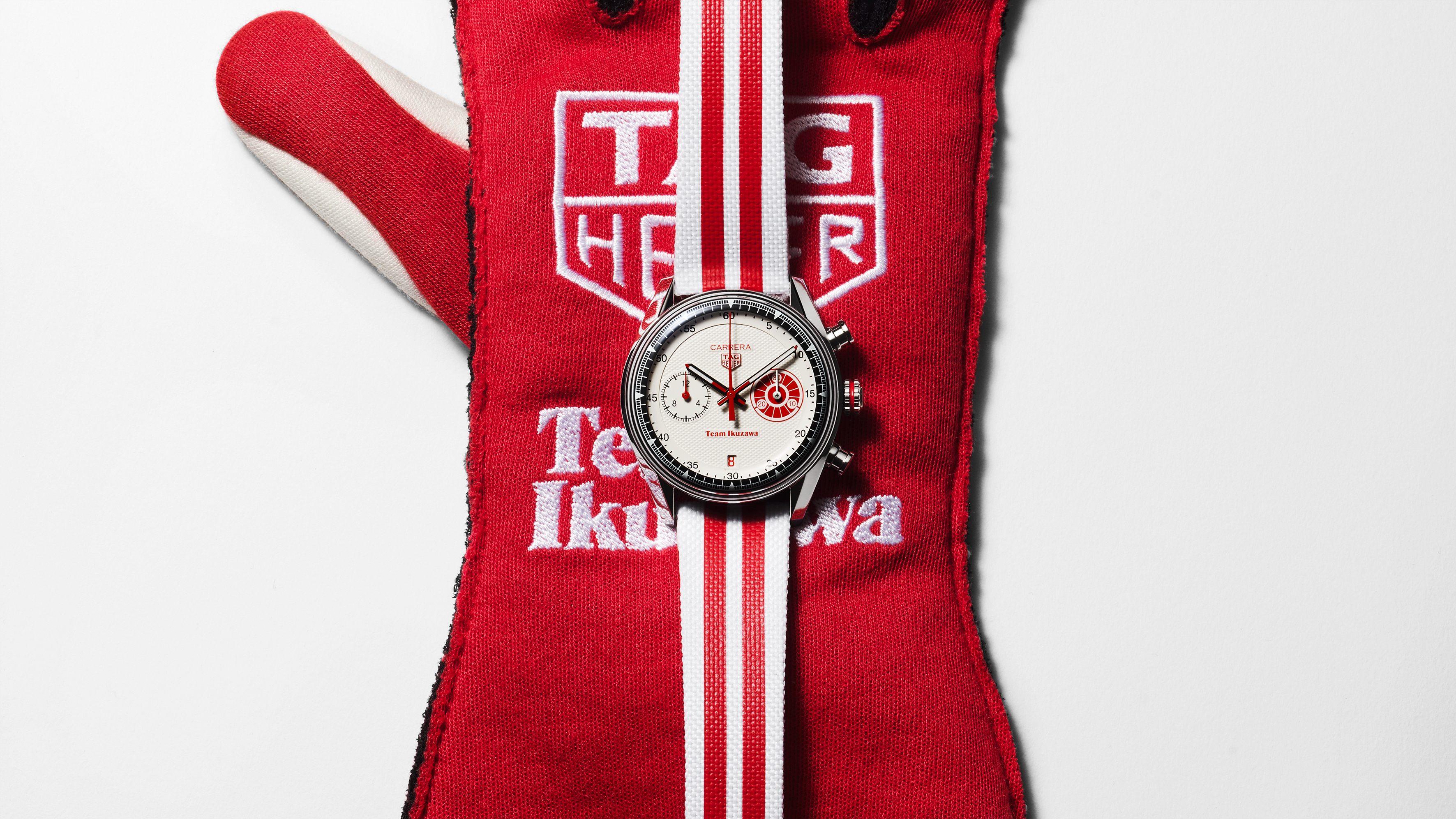 white tag heuer watc with red details