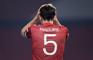Harry Maguire puts his head in his hands