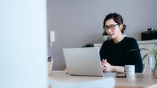 A woman using her laptop at home