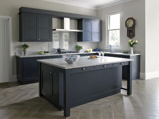 a white granite worktop in a blue kitchen