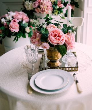 Simon Lycett flower arrangement, roses on a table