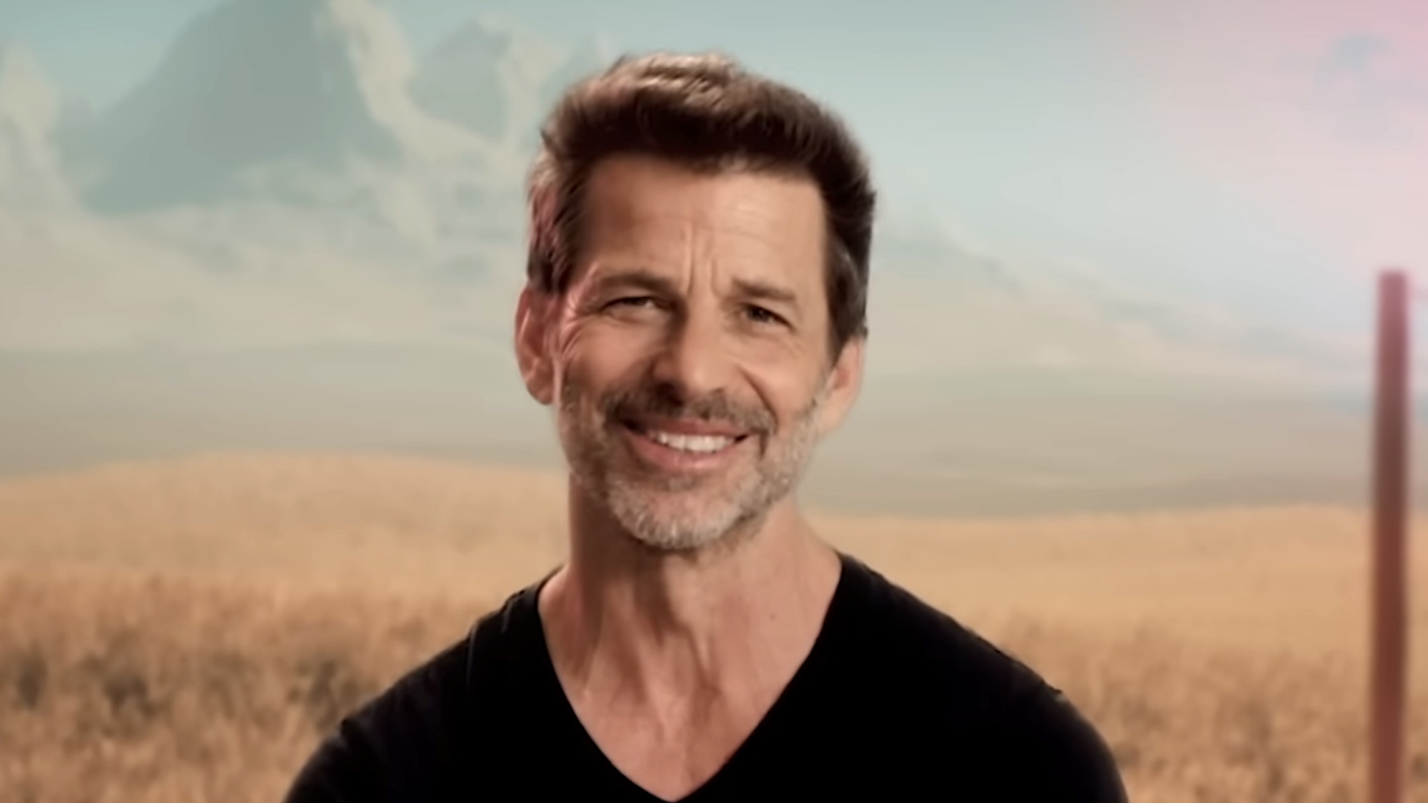 Zack Snyder smiling at camera while talking about Rebel Moon trailer for Netflix