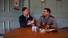 Players discuss a scorecard