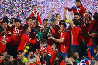 Chile players celebrate after beating Argentina on penalties to win the Copa America in 2015.