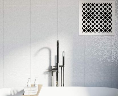 An air vent cover in a minimalist white bathroom
