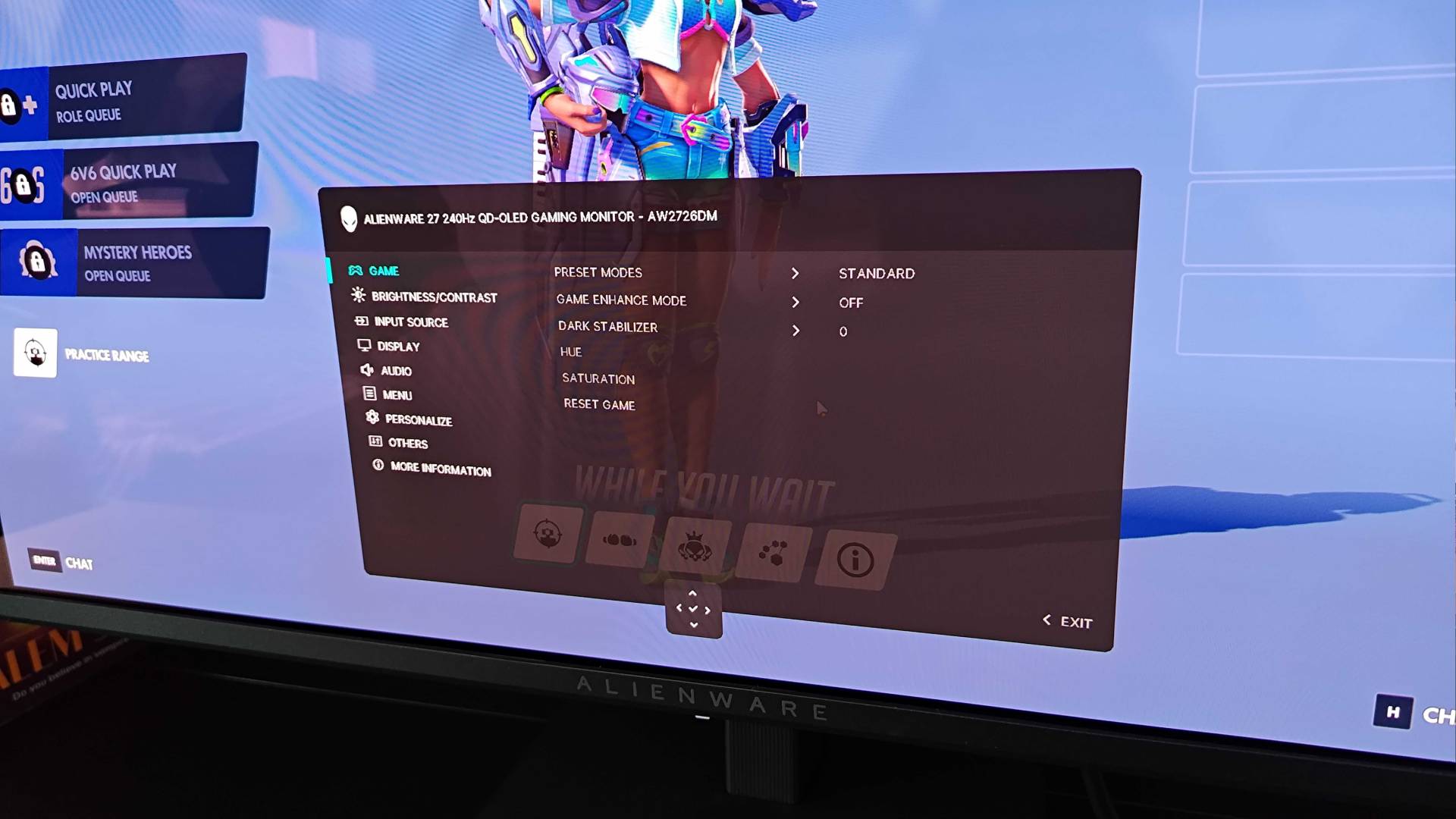Close up of Alienware AW2726DM monitor OSD menu with Overwatch running in background.